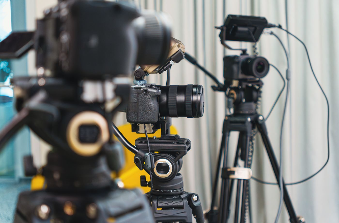 Professional video cameras arranged in a production studio