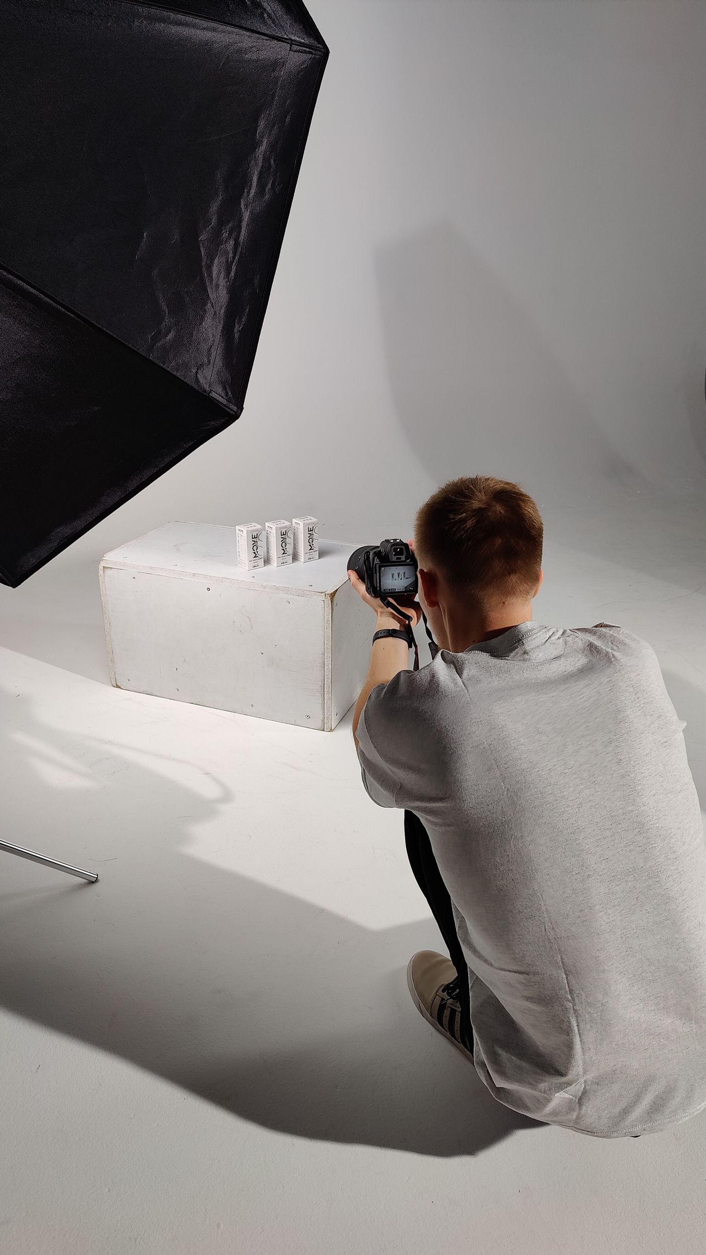 Photographer capturing product images in a professional studio